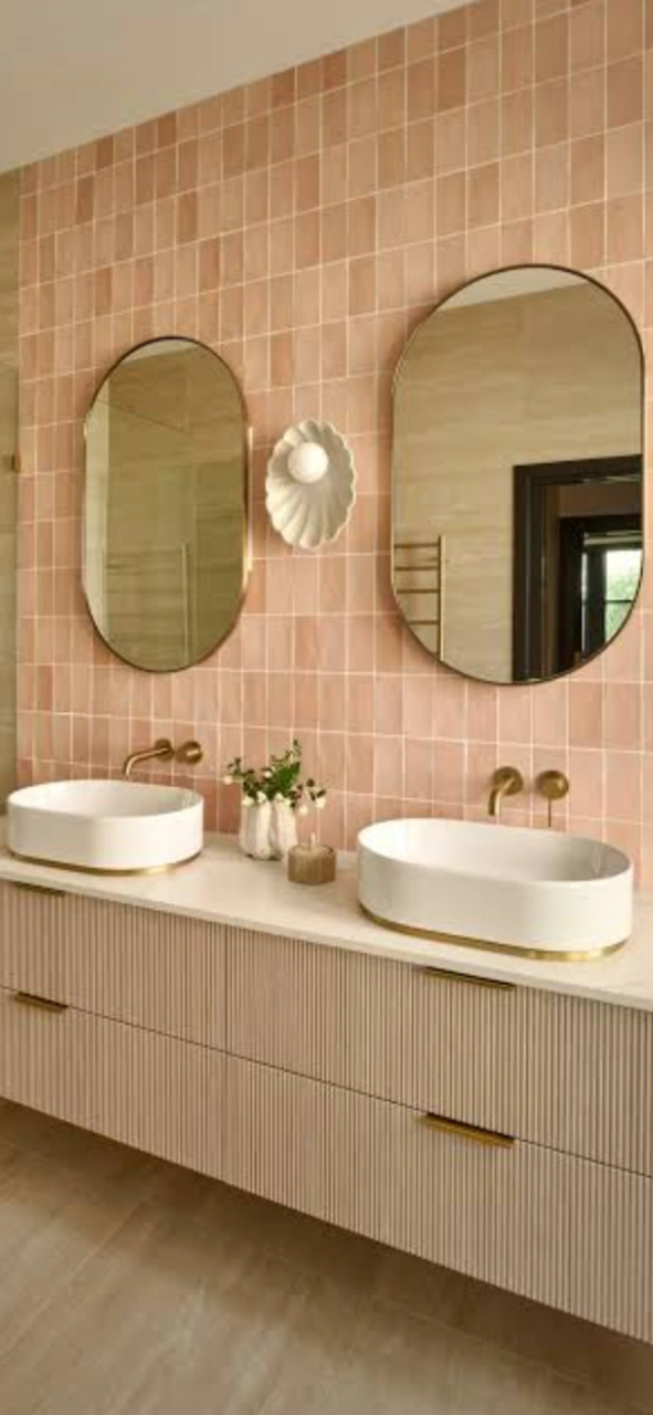 Double vanity with pink tiled wall in an Ulladulla bathroom